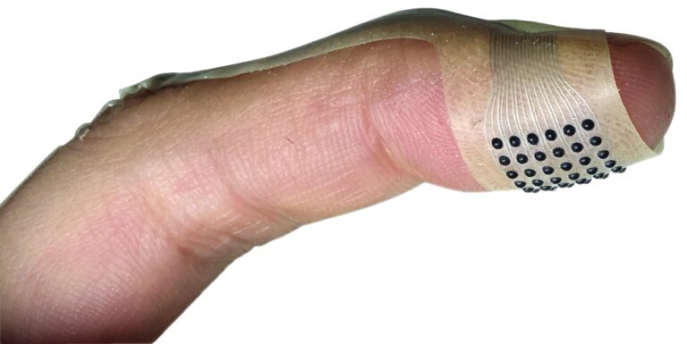 New wearable device lets you touch fabric online, read braille, and more